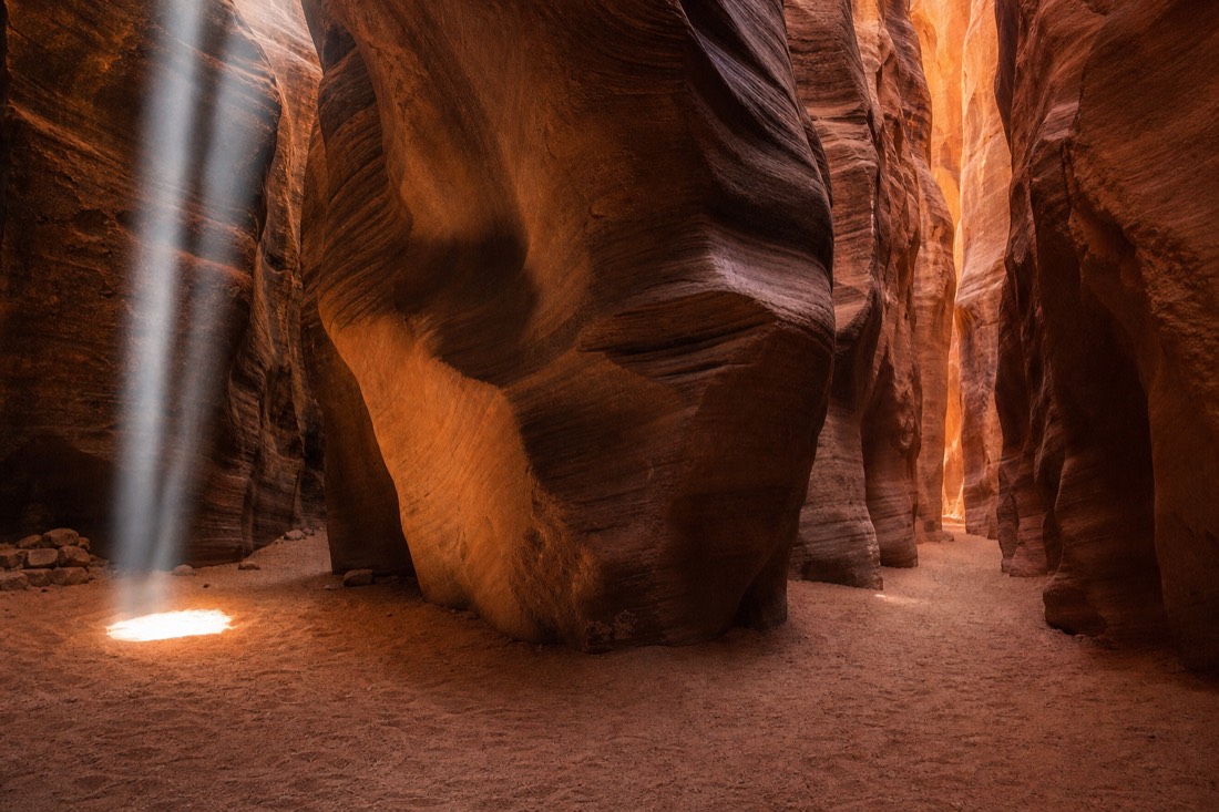 Three-way comparison scene of slot canyon textures in beam light, carved waves, and empty corridor