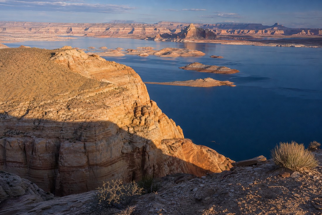 Boundary landscape where desert canyon country meets the blue water of Lake Powell