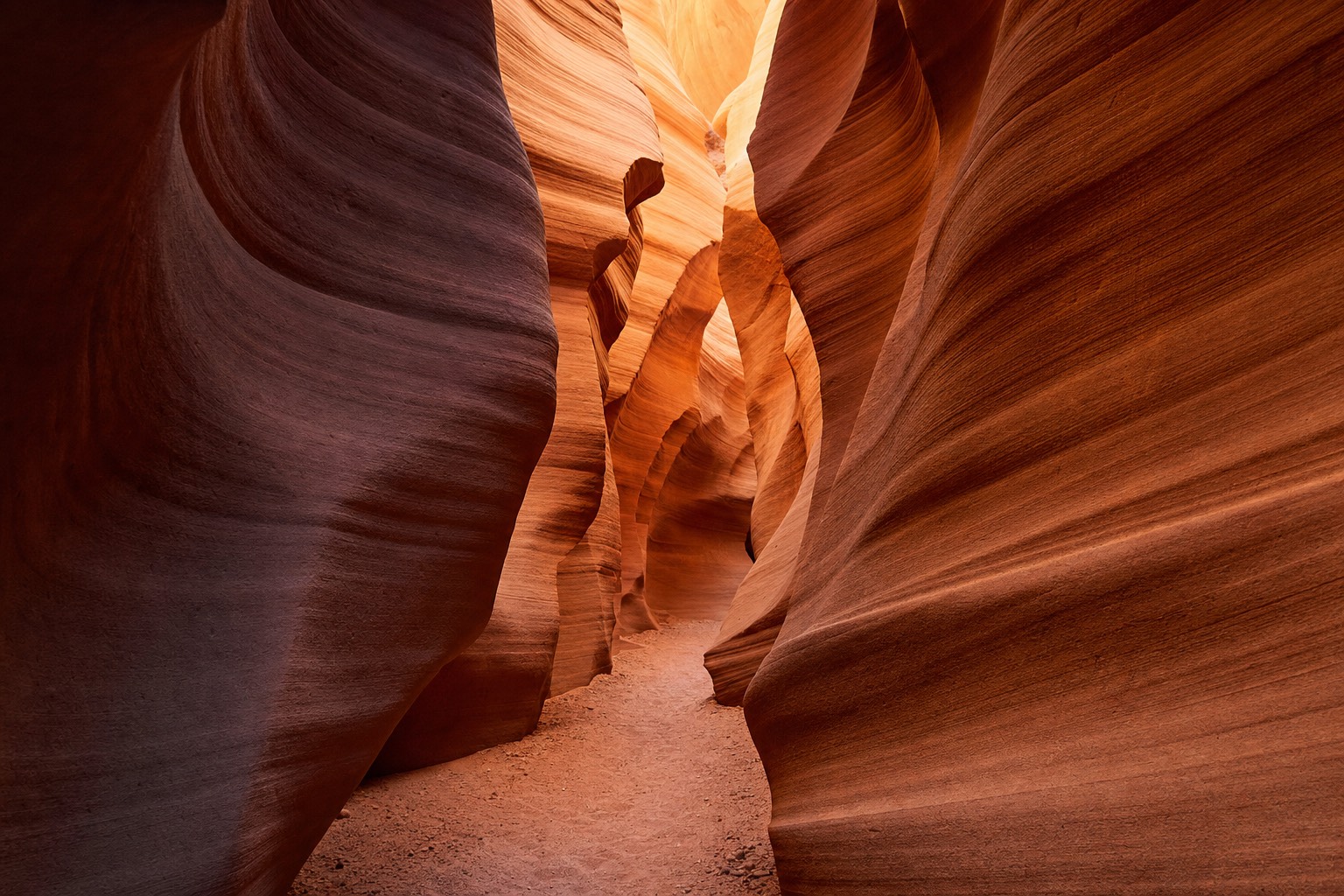 Empty slot canyon corridor with rippled orange walls and no crowds in sight