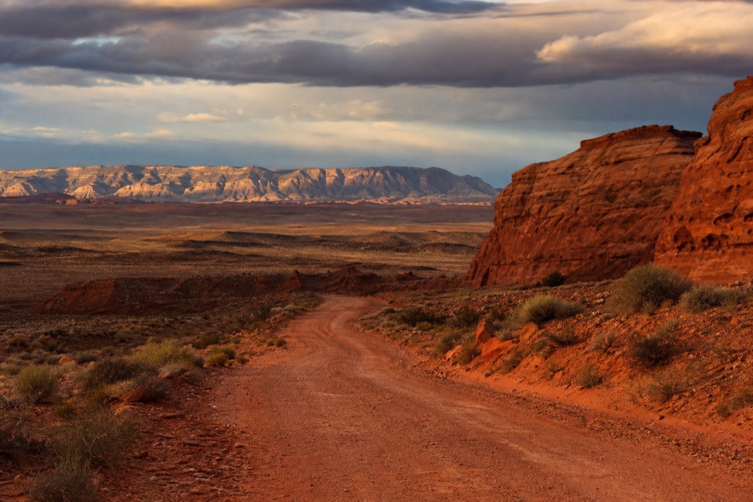 Remote desert road leading toward hidden slot canyon country near Page Arizona