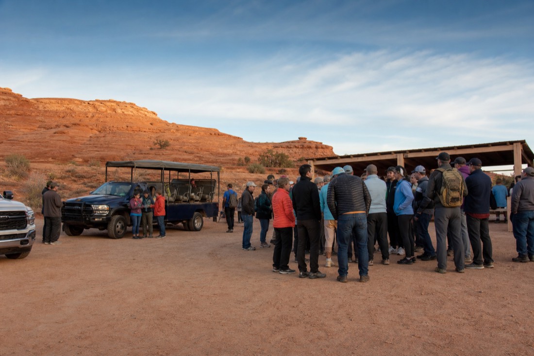Visitors gathering at a desert check-in area near Page Arizona before a canyon tour