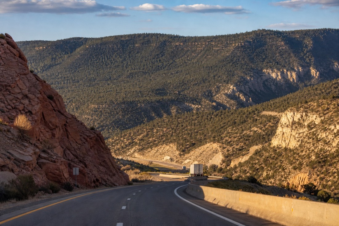 Interstate 17 climbing from desert flats toward the forested rim country of northern Arizona