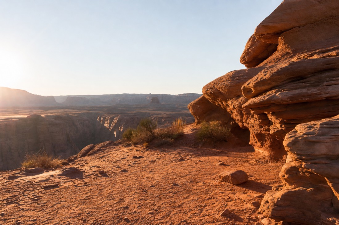 Small group gathered at a tour meeting point in early morning desert light